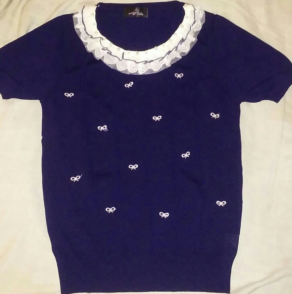 Navy sweater with ivory embellishments